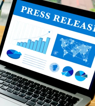 A laptop screen showed a press release content services with significant announcements and news